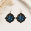 Blue Ganesha wooden earrings for women with ornate spiritual Indian art design