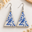 Blue bird branch wooden earrings for women – triangle dangler with cobalt blue bird and leaf print on cream white