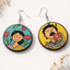 Colorful illustrated wooden earrings featuring a serene woman with flowers and a man enjoying tea, round handcrafted design
