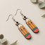 Cute pencil wooden earrings with kawaii smiling face design for women