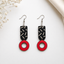 Modern geometric wooden earrings for women with black abstract pattern and red circle drop design