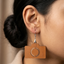 Camera shaped wooden drop earrings for women featuring minimalist photography inspired design in lightweight statement style.