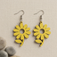 Yellow sunflower wooden earrings for women with floral cut-out design and hook closure