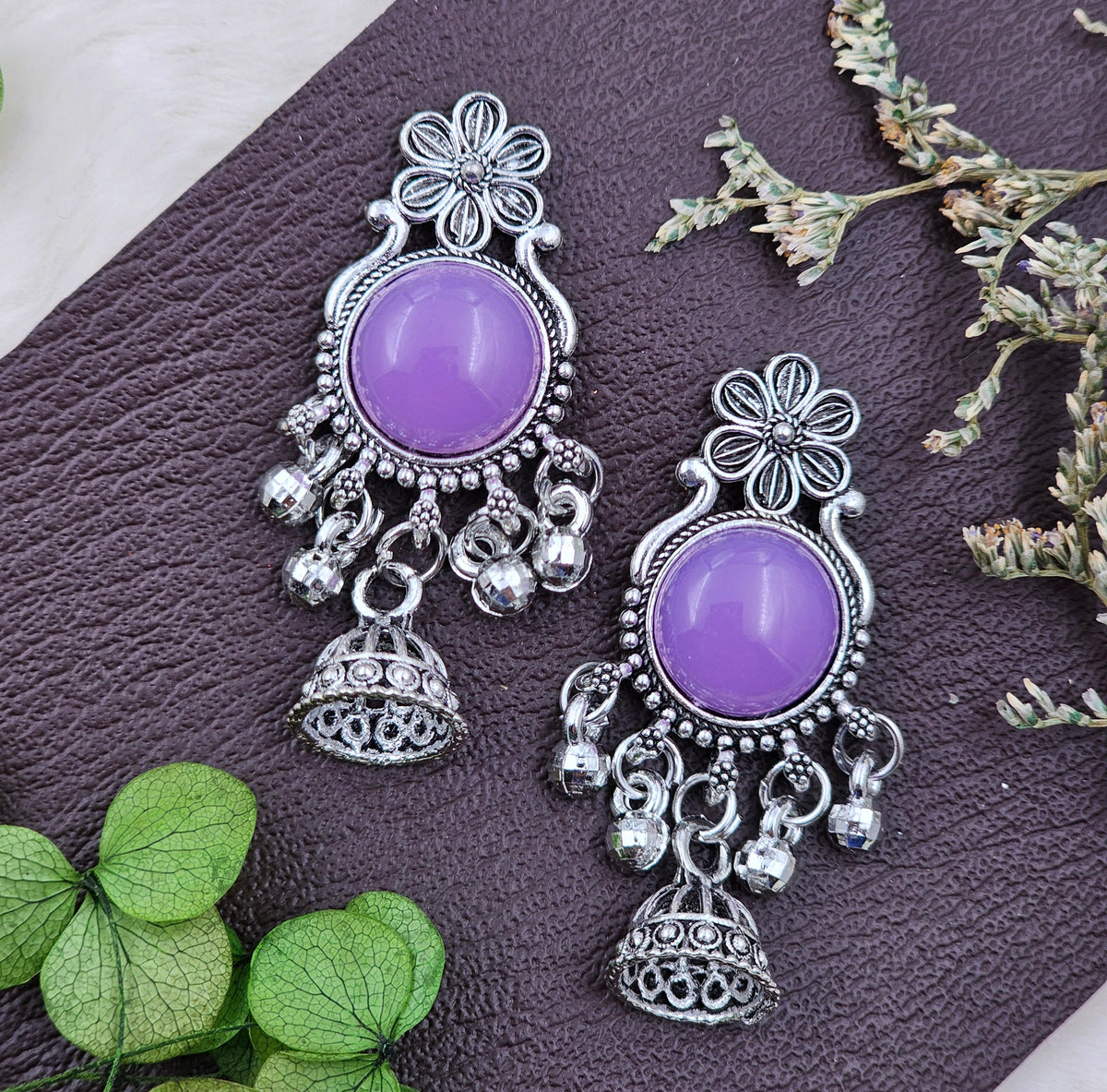 Traditional Oxidised Jhumka Earrings With Light Purple Stones.