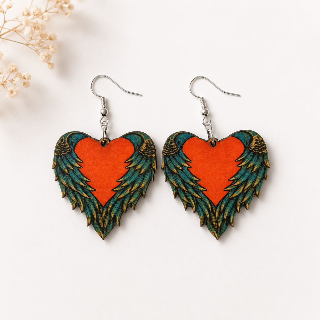 Angel wing heart wooden earrings with orange heart and teal gold feather wings
