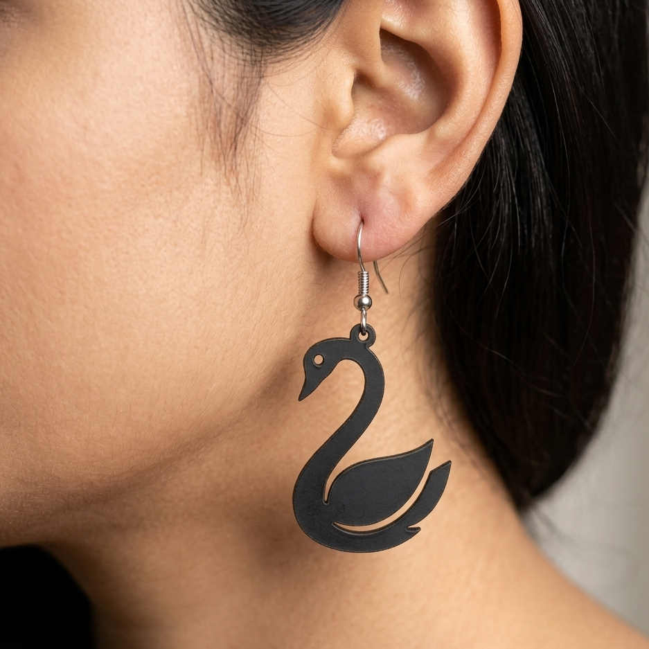 Black wooden drop earrings featuring a sleek and minimalist swan silhouette design Main image