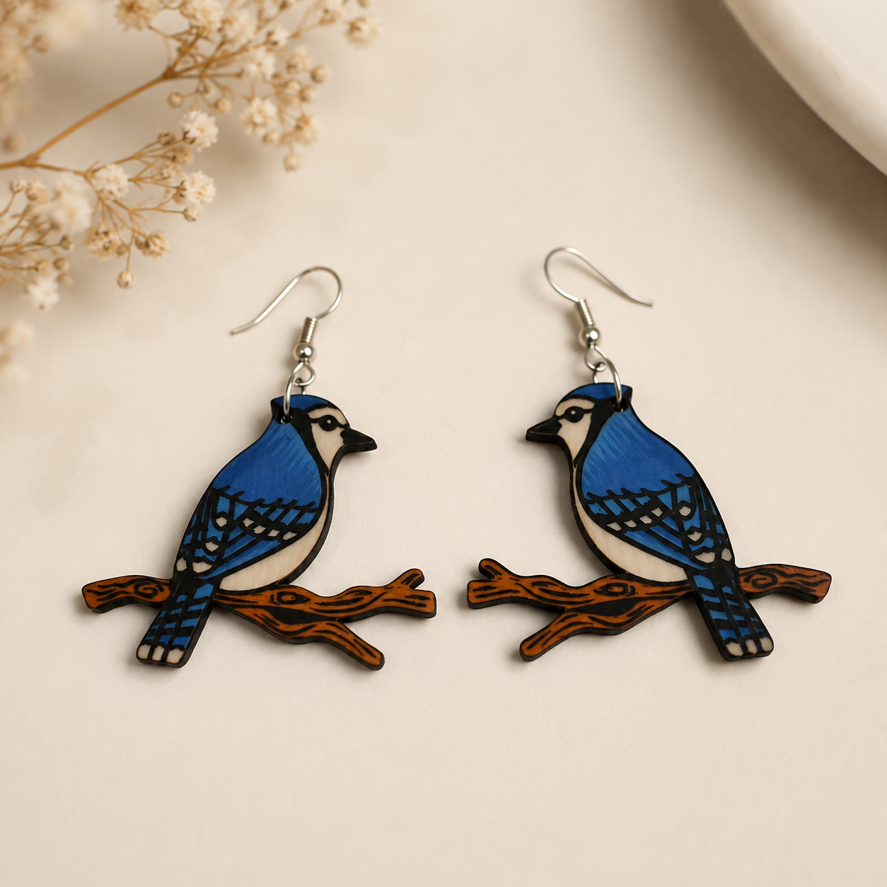 Blue jay bird wooden earrings for women featuring detailed blue bird and branch design Main image