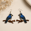 Blue jay bird wooden earrings for women featuring detailed blue bird and branch design
