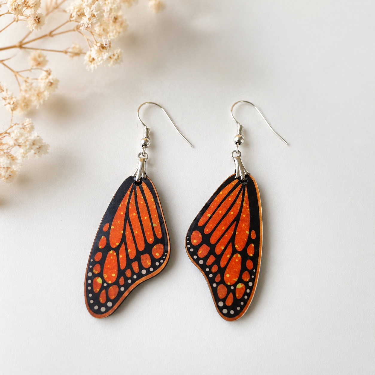 Butterfly wing wooden earrings with orange and black pattern nature inspired lightweight statement jewelry for women Main image