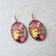 Courage the Cowardly Dog wooden earrings featuring Courage, Muriel, and Eustace in a colorful oval design with lightweight fish hook ear wires.