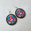 Disney Princess Ariel wooden earrings featuring Ariel with Flounder, Sebastian, and colorful underwater sea life in a round lightweight design with fish hook ear wires.