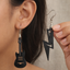 Electric guitar and lightning bolt wooden earrings for women featuring rock music inspired lightweight statement jewelry.