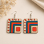 Geometric folk art wooden earrings for women with red blue green abstract pattern