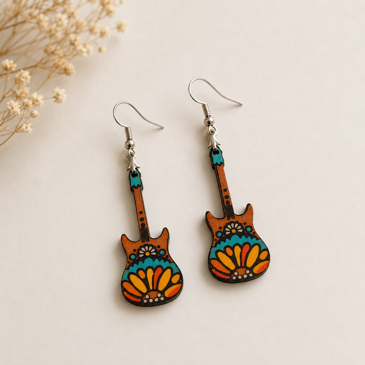 Handcrafted guitar wooden earrings for women with colorful boho folk artwork and lightweight musical statement design on a minimal neutral background. Main image