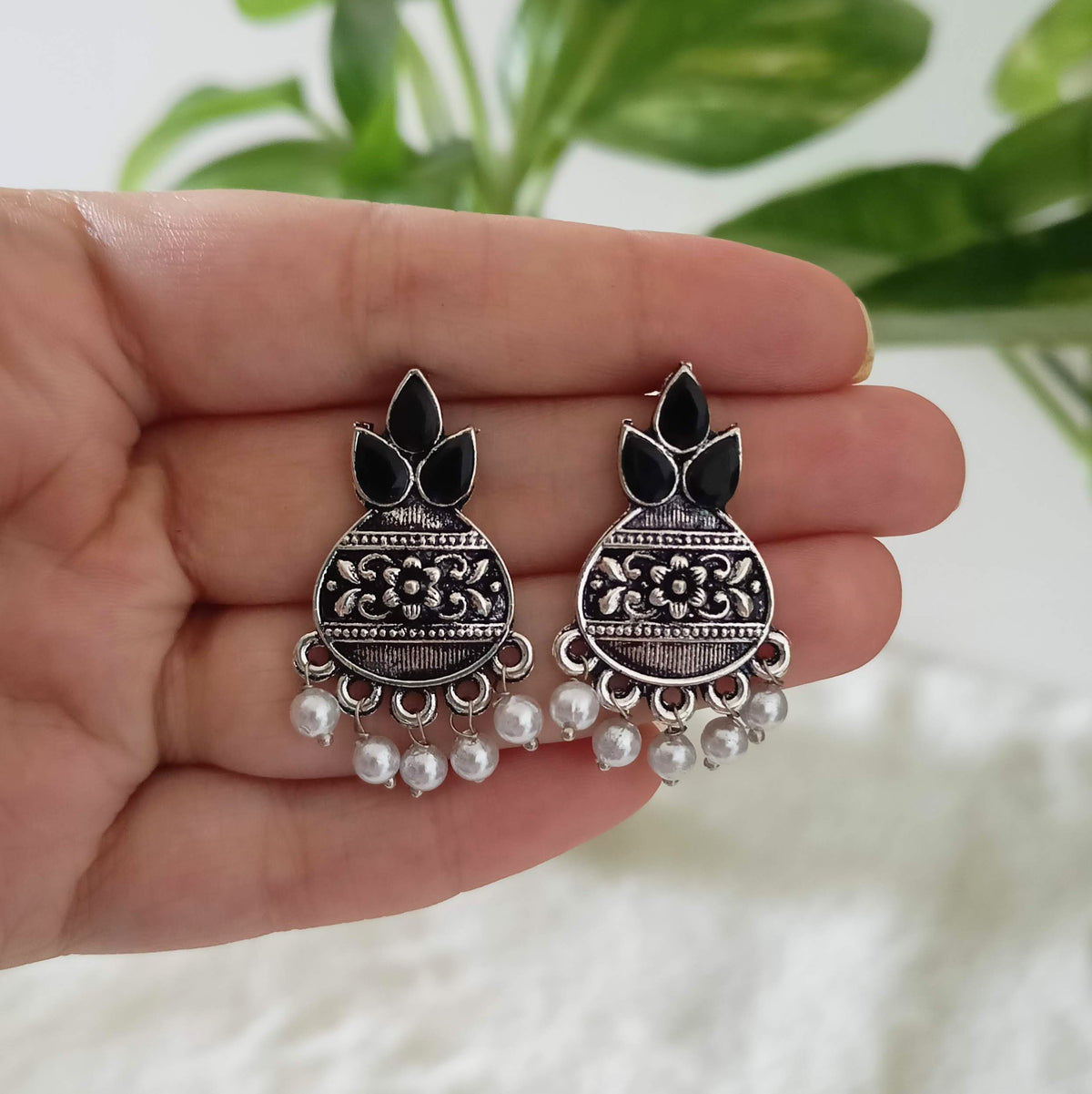 Kalash Shape Black Stone Studded Silver Oxidised Earrings