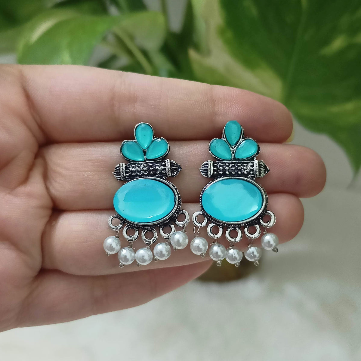 Aqua Blue Color Stone Studded Oval Shape Silver Oxidised Earrings