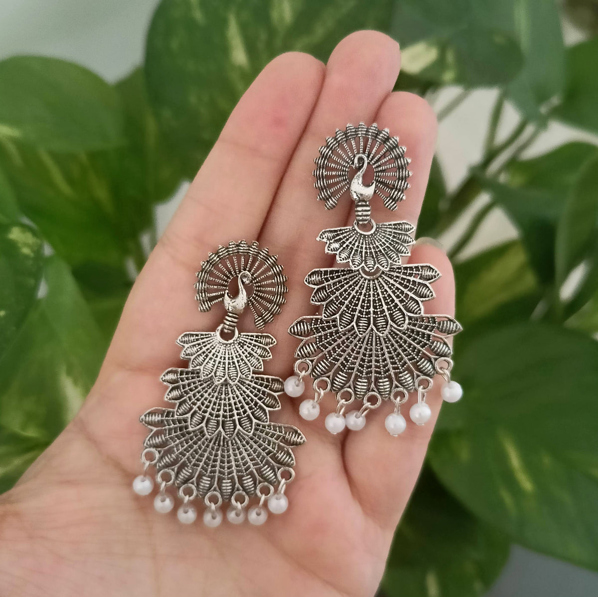 Dancing Peacock Drop White Beads Oxidised Silver Earrings
