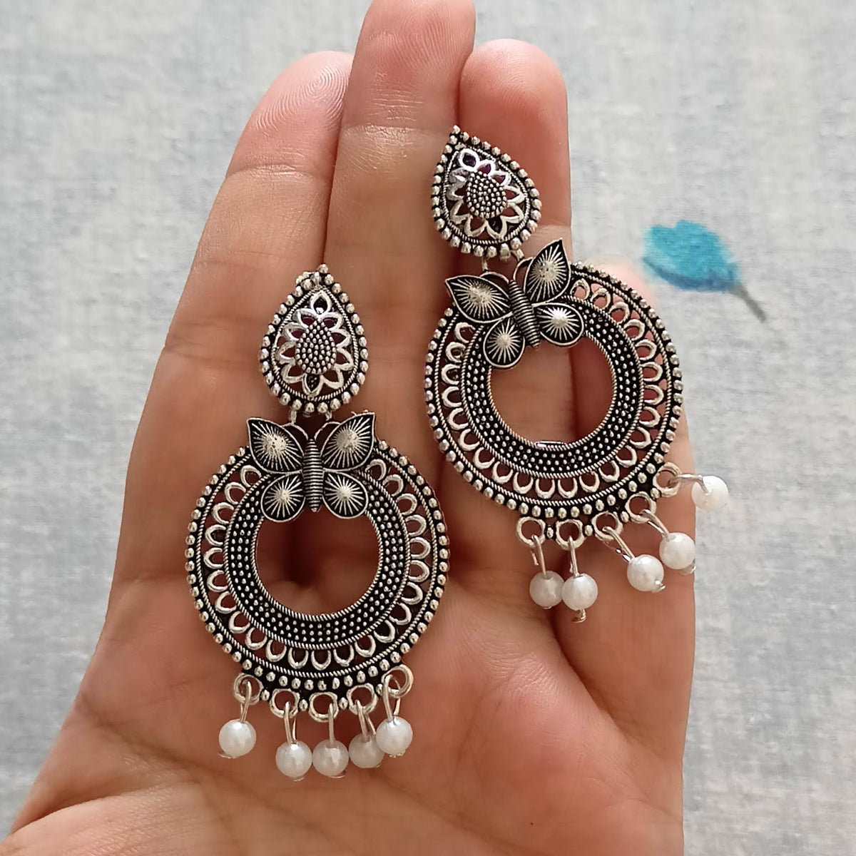 Round Butterfly Design White Beads Oxidised Silver Ethnic Earrings