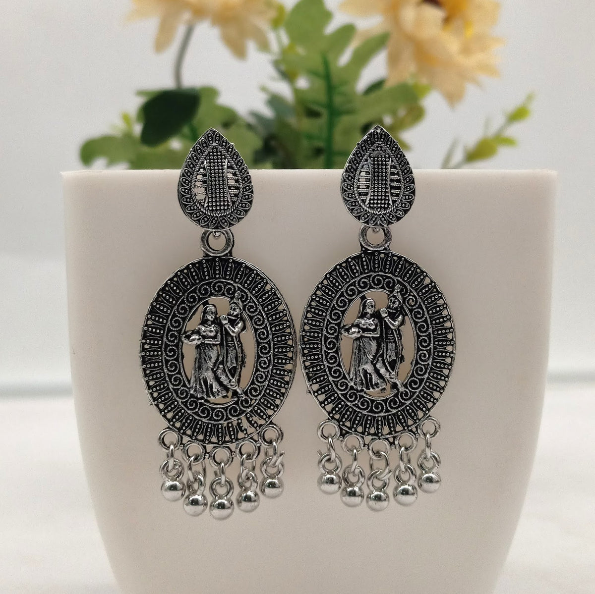 Radha Krishna Oval Shape Trendy Silver Oxidised Earrings
