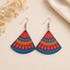 Indian folk art wooden earrings for women with colorful red blue and orange fan-shaped design