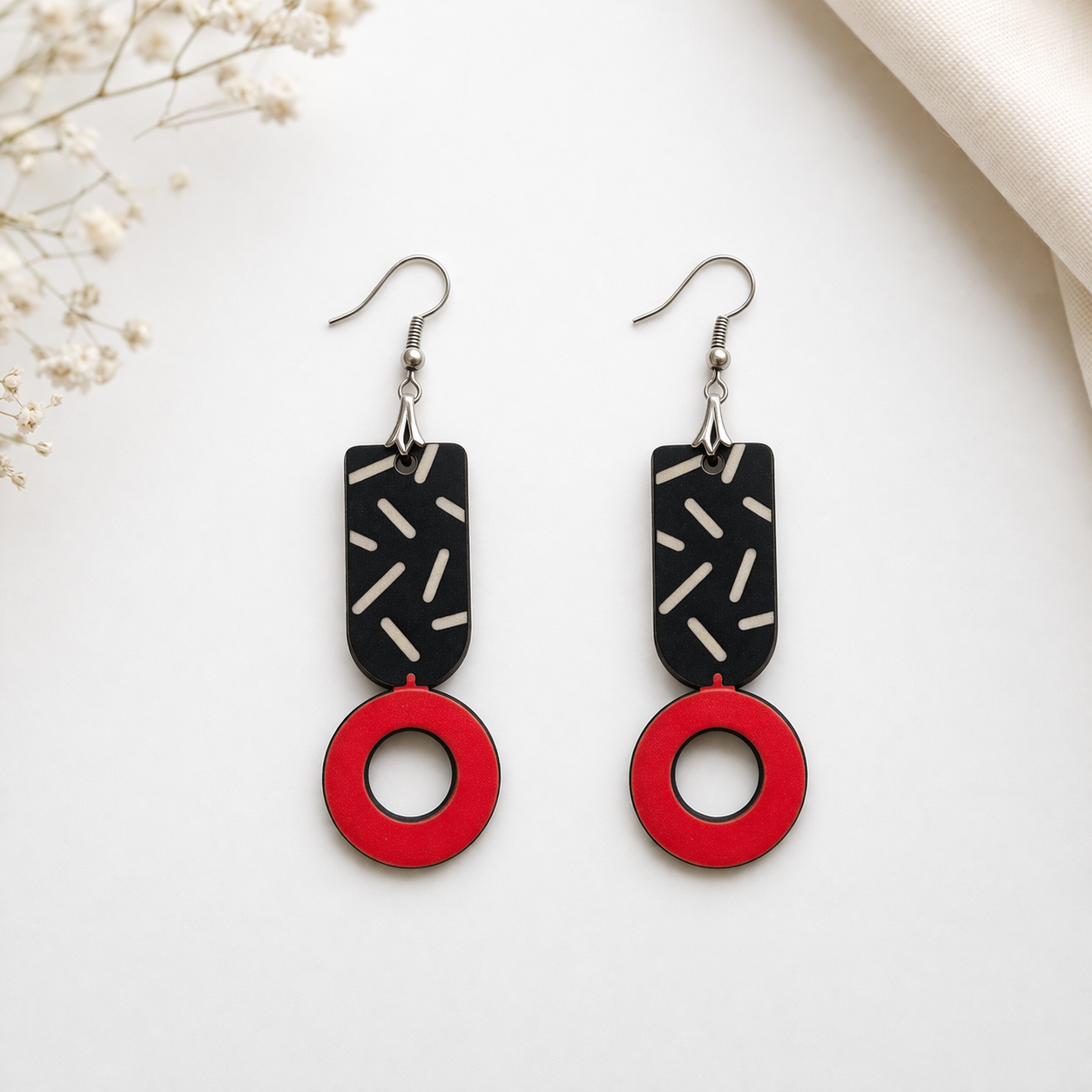 Modern geometric wooden earrings for women with black abstract pattern and red circle drop design