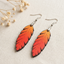 Orange gradient leaf wooden earrings for women with minimal rustic design and hook closure