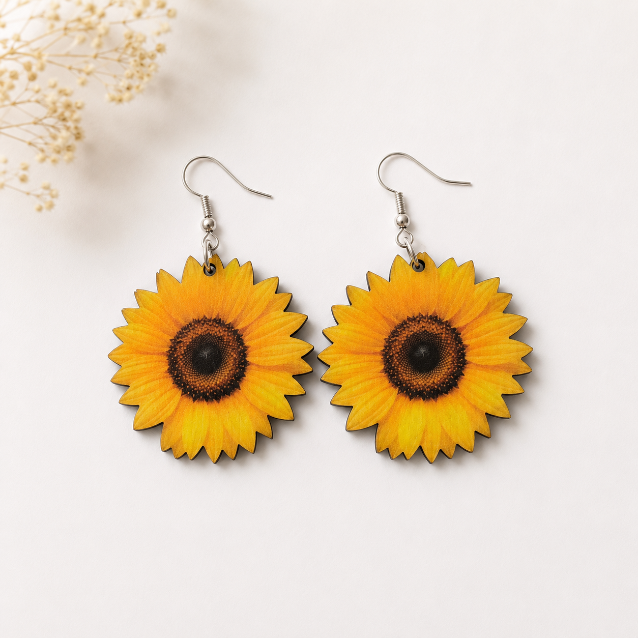 Realistic sunflower wooden earrings with golden yellow petals and brown center
 Main image