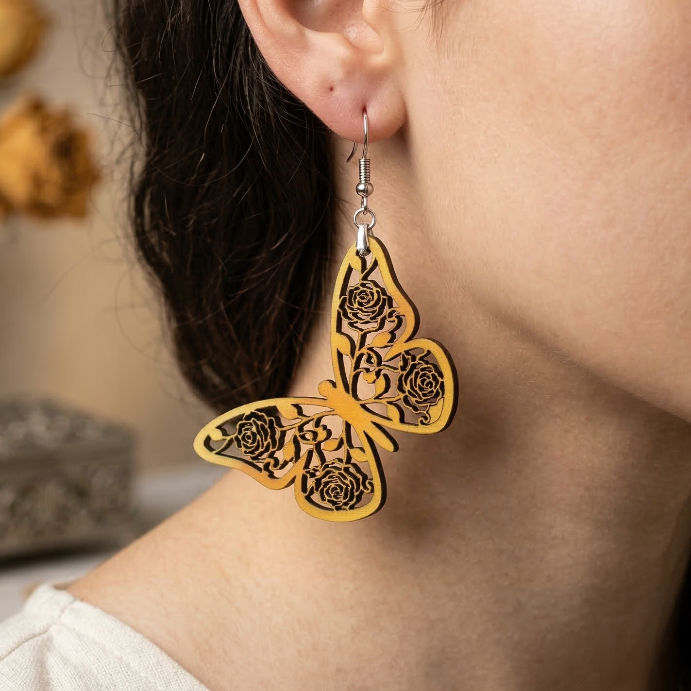 Butterfly wooden earrings with intricate rose floral cutwork design Main image
