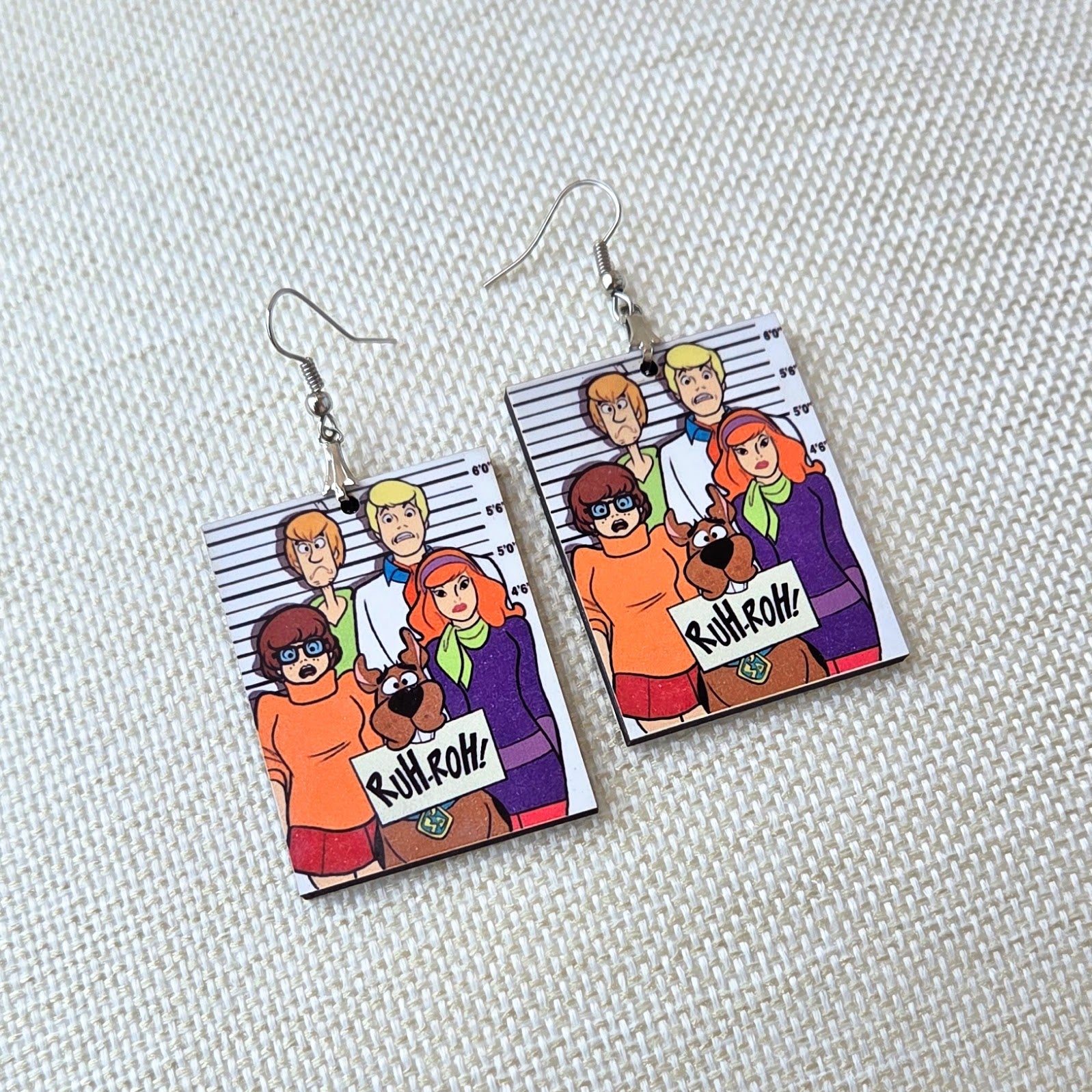 Scooby-Doo Mystery Inc. wooden earrings featuring Scooby-Doo, Shaggy, Velma, Fred, and Daphne in a colorful mugshot-style design for women. Main image