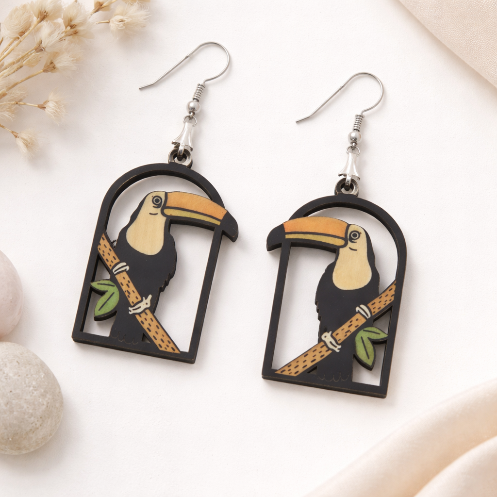 Toucan bird wooden dangle earrings with tropical design and cutout frame for women Main image
