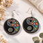 Yin Yang mandala wooden earrings with colorful dot art design on black round base, lightweight boho spiritual jewelry